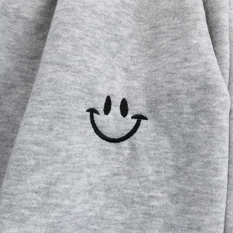 Pantalon de jogging ample à smiley appliqué