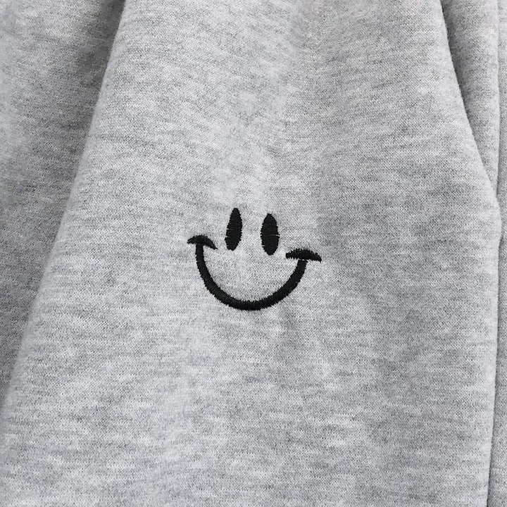 Pantalon de jogging ample à smiley appliqué